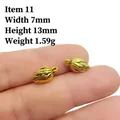 Detailed view of two small antique gold peanut pendants with leaf veins and dimensions - 11# Leaf Pendant
