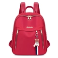 Stylish red nylon backpack for women with gold zippers and a cute bear charm - Red with Pendant
