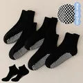 Close-up of non-slip silicone dots on the sole of black mesh ankle socks for kids - Dotted Flat Pull-Tab Socks / 5 Pairs/Pack / Black / 8mo-2yr XS (Foot 9-12cm)