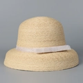 Detail of raffia cloche hat featuring tight woven texture and white lace ribbon bow - M(56-58cm) / White Strap