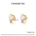 Detailed view of heart-shaped shell earrings with gold beaded stainless steel borders - Gold Earrings