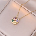 Macro shot of gold-plated necklace with four-color crystal heart clover pendant on satin - Colorful Heart Clover (Gold Chain)