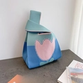 Knitted handbag with pink tulip pattern in green and blue colorblock design - Blue Tulip
