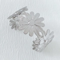 Polished silver stainless steel open bangle featuring intricate daisy flower cutouts - Fresh Sweet Daisy Style (A1123) / Silver