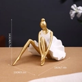 Golden ballerina sculpture in a sitting pose with a white pleated dress decor - Gold Ballet Sitting