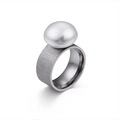Brushed stainless steel ring with a large white pearl bead on a white background - US 7 / Matte Steel 10mm Wide (KR45439-K)