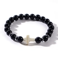 Close-up of black beaded bracelet featuring white cross charm and silver spacers - Black (Onyx Color)
