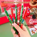 Close-up of Christmas press-type gel pens with Santa and tree prints in festive red and green - Retractable Christmas Gel Pen