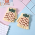 Detail of yellow knit pineapple convertible gloves with warm plush lining on pastel backdrop - 3-9 Years / Yellow