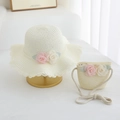 Detail of cream straw sun hat and matching bag with floral accents and lace trim - Milk White Set