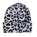 Close-up of black and white leopard print knit beanie with folded cuff detail - Leopard Print - Black & White