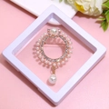 Golden crown brooch with pearls and rhinestones on a pink background for elegant styling - XZ107-Crown Pearl-Boxed