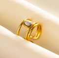 Detail of bohemian gold layered ring with hand-hammered texture and teardrop stone - Gold - White Faux Stone