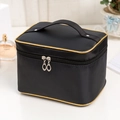 Large black satin cosmetic bag with golden piping and top handle for travel storage - Black with Gold Edge