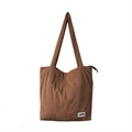 Detailed macro view of brown corduroy tote bag featuring vertical texture and zipper closure - Dark Brown