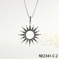 Macro shot of sunburst pendant with black zircon in silver metal on a box chain - Silver Black Zircon Sun