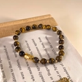 Detail of 18K gold-plated tiger eye beaded bracelet with a cute golden animal charm - Tiger Eye Beaded Style (Gold-Brown)