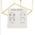 Six pairs of silver metal ball stud earrings set on a white 'Monday to Saturday' card - 6 Pairs Gradient Size Silver Metal Ball Style (K49-7G)