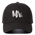 Close-up of 'Mr.' white 3D embroidery on a black cotton twill baseball cap with curved brim - Dark Grey MR