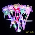 Macro view of five LED glowing heart fairy wands with colorful beads and silk ribbons - Starry Sky Magic Wand (Heart Shape)