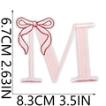 Detailed pink embroidered letter M patch with bow decoration and size measurements - Bow Alphabet Letter M