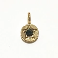 Golden round pendant with dark gemstone and engraved star design for necklaces - Gold - May
