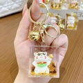 Golden acrylic lucky cat keychain with sparkling gold sequins and bell pendant - Lucky Cat Family - Eyes Full of Money / Individual Packaging