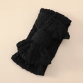 Close-up of black oversized bow headband for babies made of textured stretchy fabric - Black