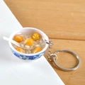 Miniature blue and white porcelain bowl pendant with yellow dessert balls and spoon - Corn Porridge
