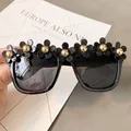 Chic black round sunglasses with golden flower embellishments for seaside vacations - No. 17 (Black Flowers)
