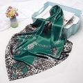 Detail of emerald green silk scarf featuring leopard print, chains, and baroque patterns - 90x90cm / Green