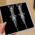 Silver drop earrings featuring elegant double butterfly tassels and sparkling rhinestones - Double Bow Full Rhinestone Long Earrings (E0024)