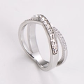 Macro detail of X-shaped stainless steel ring with princess-cut cubic zirconia stones - US 5 / Steel