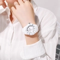 Close-up of a white quartz watch with silicone strap worn on a wrist for children - White