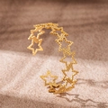 Polished 18K gold plated heart and star C-shape bangle on a warm sand background - Pentagram