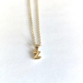Detailed view of a gold-plated letter Z pendant necklace on a clean white background - Letter Z