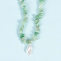 Irregular green crystal bead necklace with a baroque pearl pendant on blue background - Green Aventurine Pearl