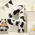 Detail view of a 40-inch cow print number 4 foil balloon for animal theme party decor - Cow Pattern Style 4