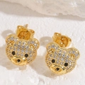 Macro detail of gold-plated bear stud earrings with sparkling pave-set cubic zirconia - Little Bear Studs / Gold White Zirconia