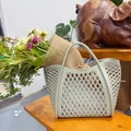 Hollow silicone tote bag in sage green with woven diamond pattern and dual handles - Gray