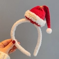 Christmas headband featuring a red mini Santa hat with gold Merry text and white plush trim - Starry Red Santa Hat Headband
