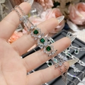 Detailed macro view of square emerald green gemstone bracelet with dense zircon inlay - 3-Stone Square Green Gem Style (0049)