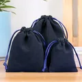 Three deep blue velvet drawstring pouches for jewelry in small, medium, and large sizes - Navy Blue