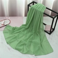 Solid light green pearl chiffon scarf for women shown in elegant lifestyle setting - 175cmx70cm / Mint Green