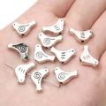 Silver bird shaped alloy charms with spiral and line patterns for DIY jewelry making - Pigeon / 13x12mm