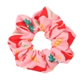 Close-up of pink Christmas scrunchie with festive patterns of Santa hats and candy canes - Pink