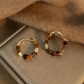 Detail of gold hoop earrings with amber resin beads on a brown velvet surface - 8# Vintage Square Bead Ear Buckle (8#)