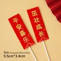 Traditional red Chinese cake toppers featuring golden text Ping An Xi Le and size 9.5x3.4cm - Rectangular Blessing Topper