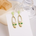 French style floral drop earrings with green accents and white petals on a gold oval frame - Green Ball Oval Floral Drop Earrings