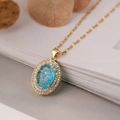 Luxurious gold-plated oval pendant necklace with a blue gemstone and zircon halo - Blue